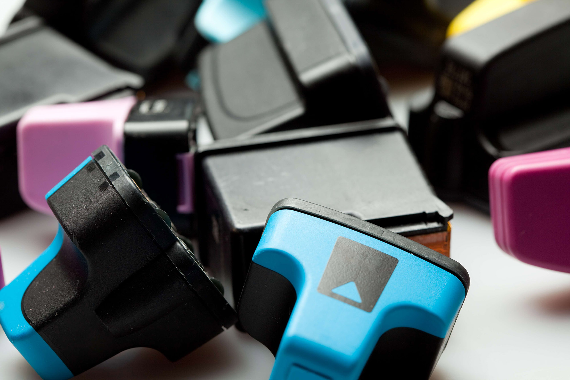 A collection of multicolored plastic cartridges.