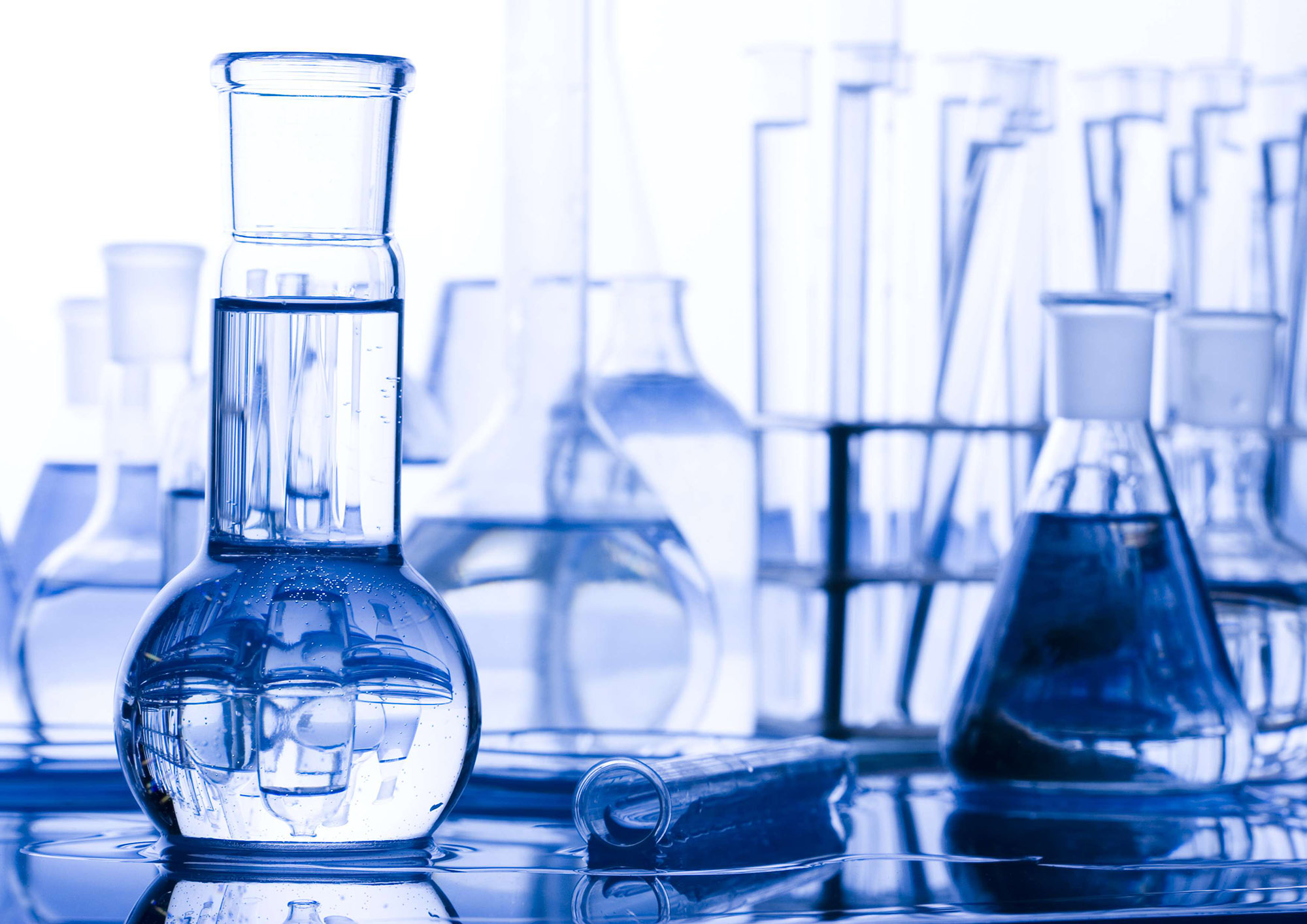 Clear liquids in blue beakers.