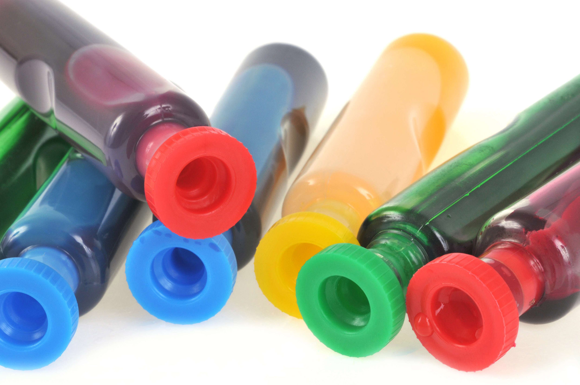 Small ink cartridges of primary colors.